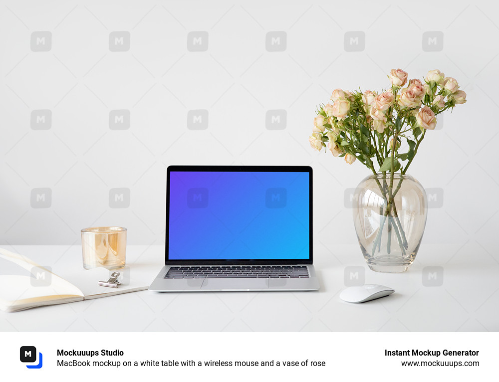 MacBook mockup on a white table with a wireless mouse and a vase of rose