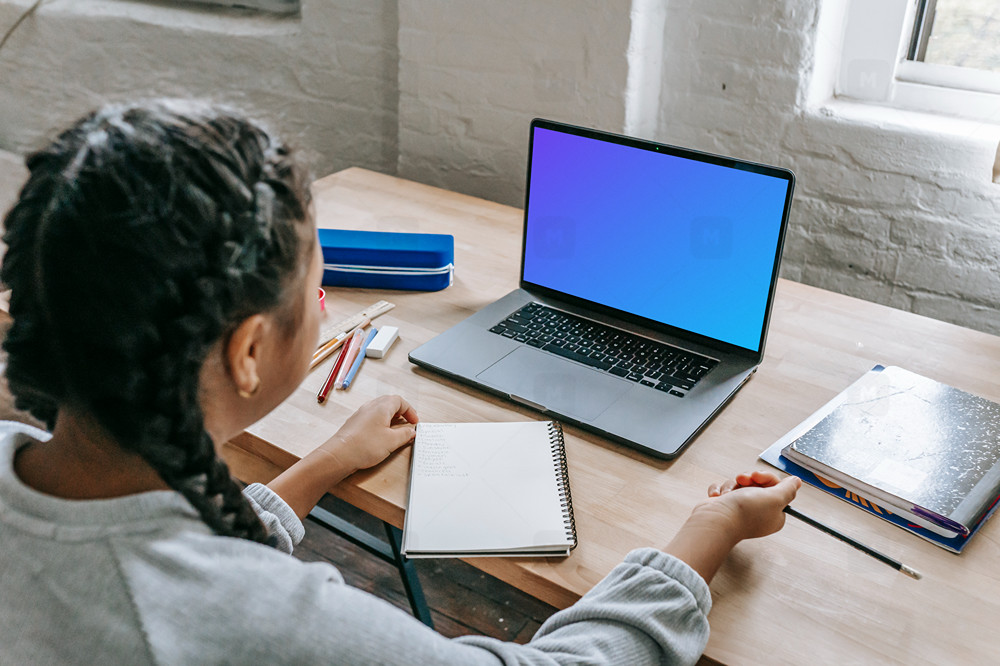 Young Girl use a MacBook Pro mockup