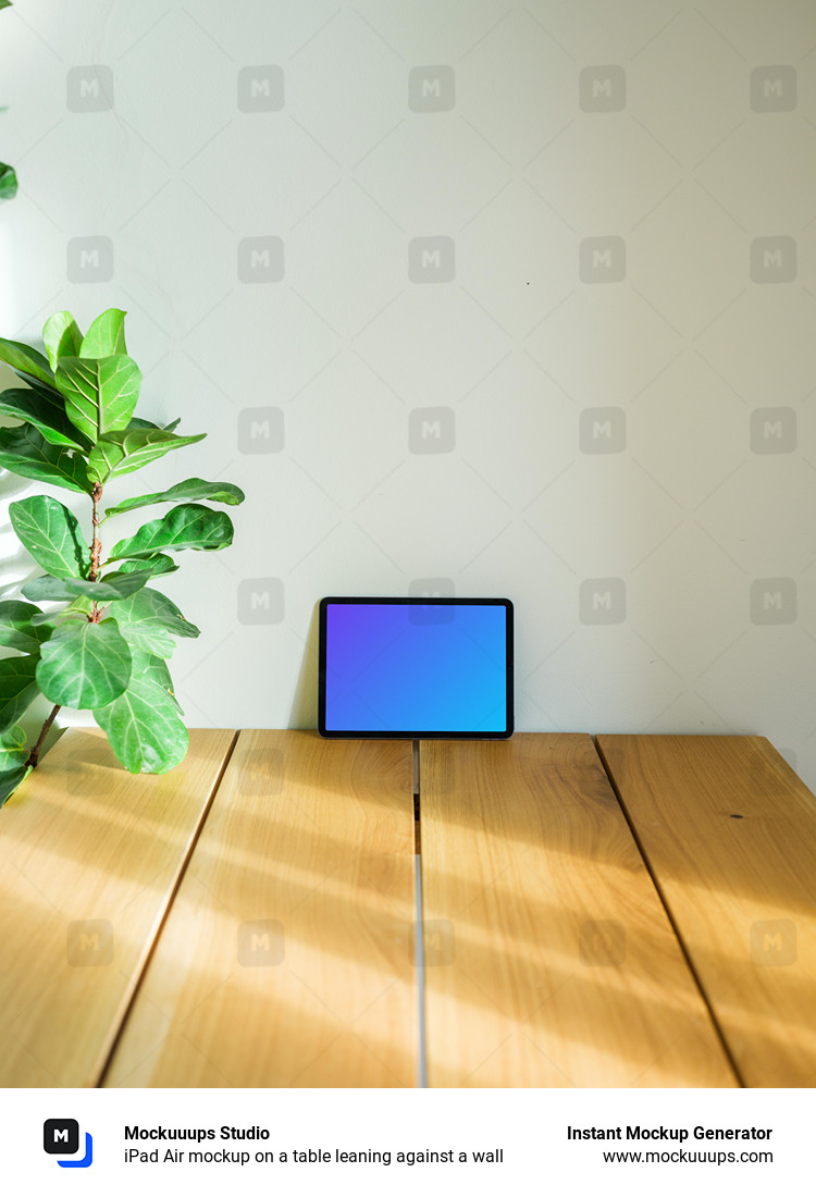 iPad Air mockup on a table leaning against a wall