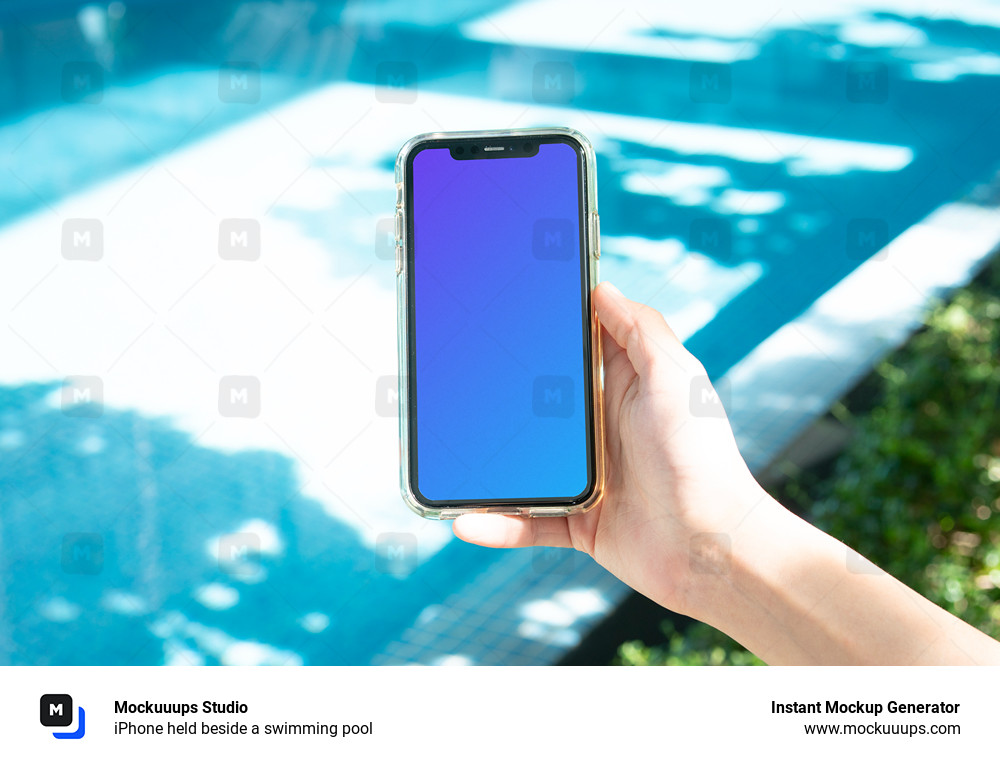 iPhone held beside a swimming pool