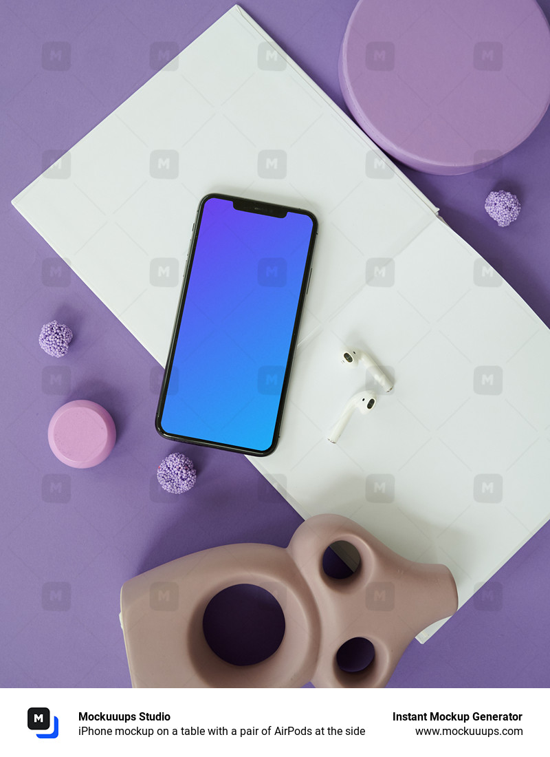 iPhone mockup on a table with a pair of AirPods at the side