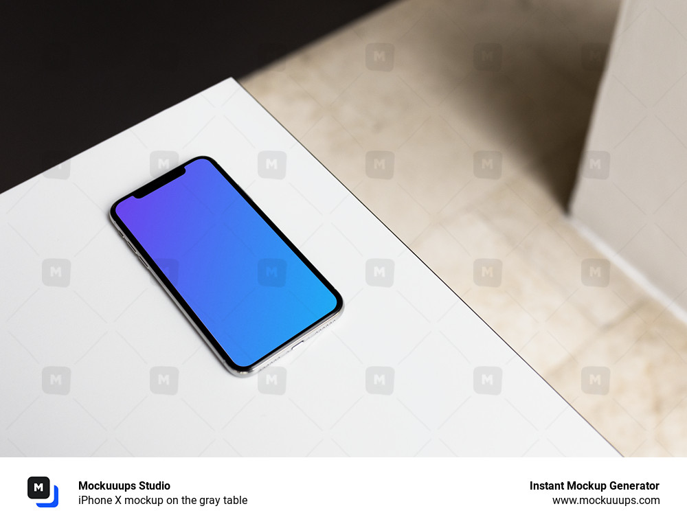 iPhone X mockup on the gray table