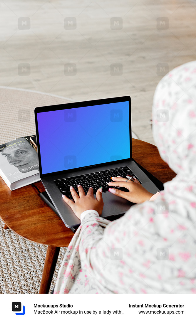 MacBook Air mockup in use by a lady with a head covering