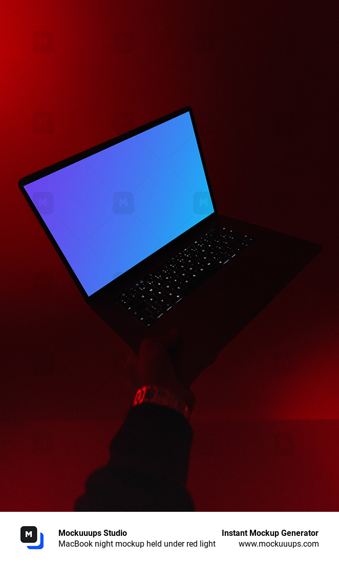 MacBook night mockup held under red light