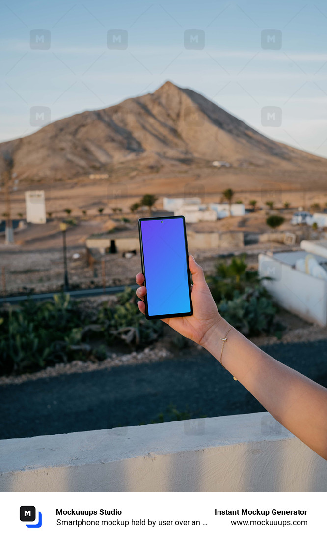 Smartphone mockup held by user over an open field