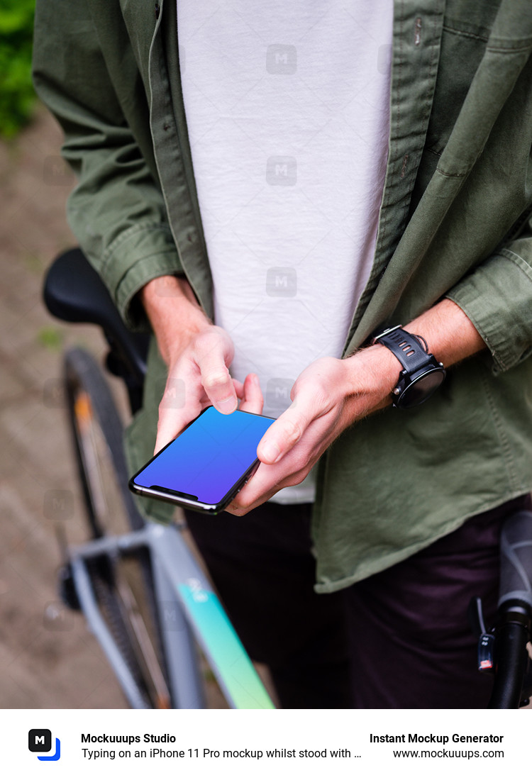 Typing on an iPhone 11 Pro mockup whilst stood with a bike