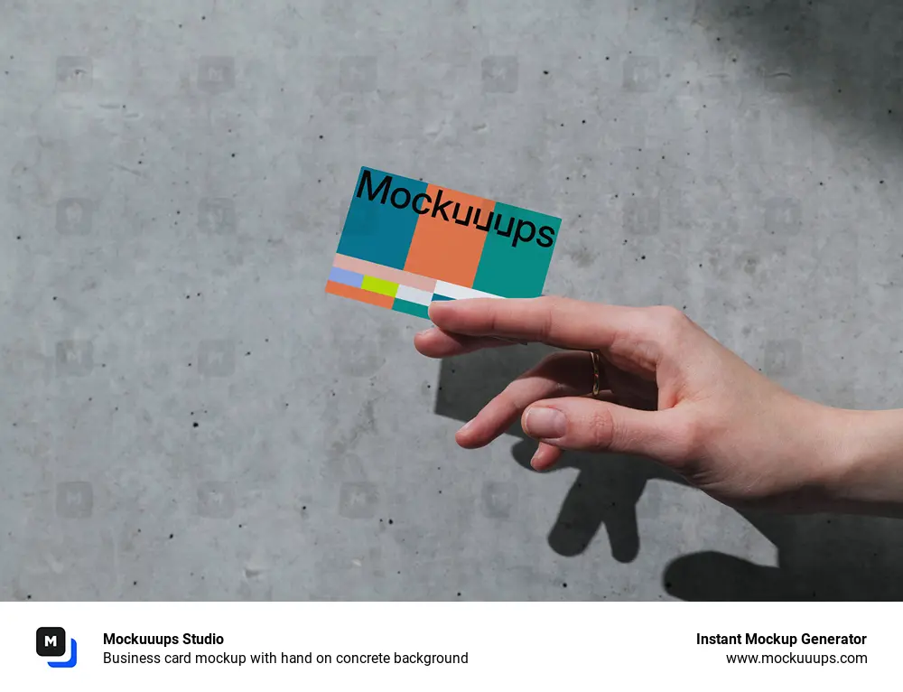 Business card mockup with hand on concrete background