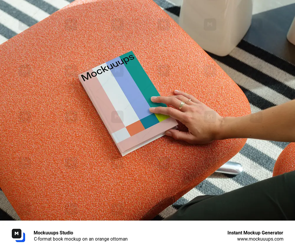 C-format book mockup on an orange ottoman