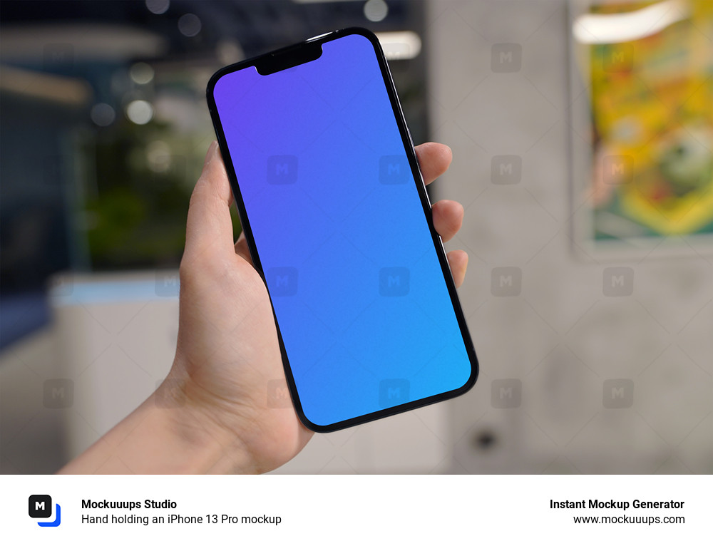 Hand holding an iPhone 13 Pro mockup