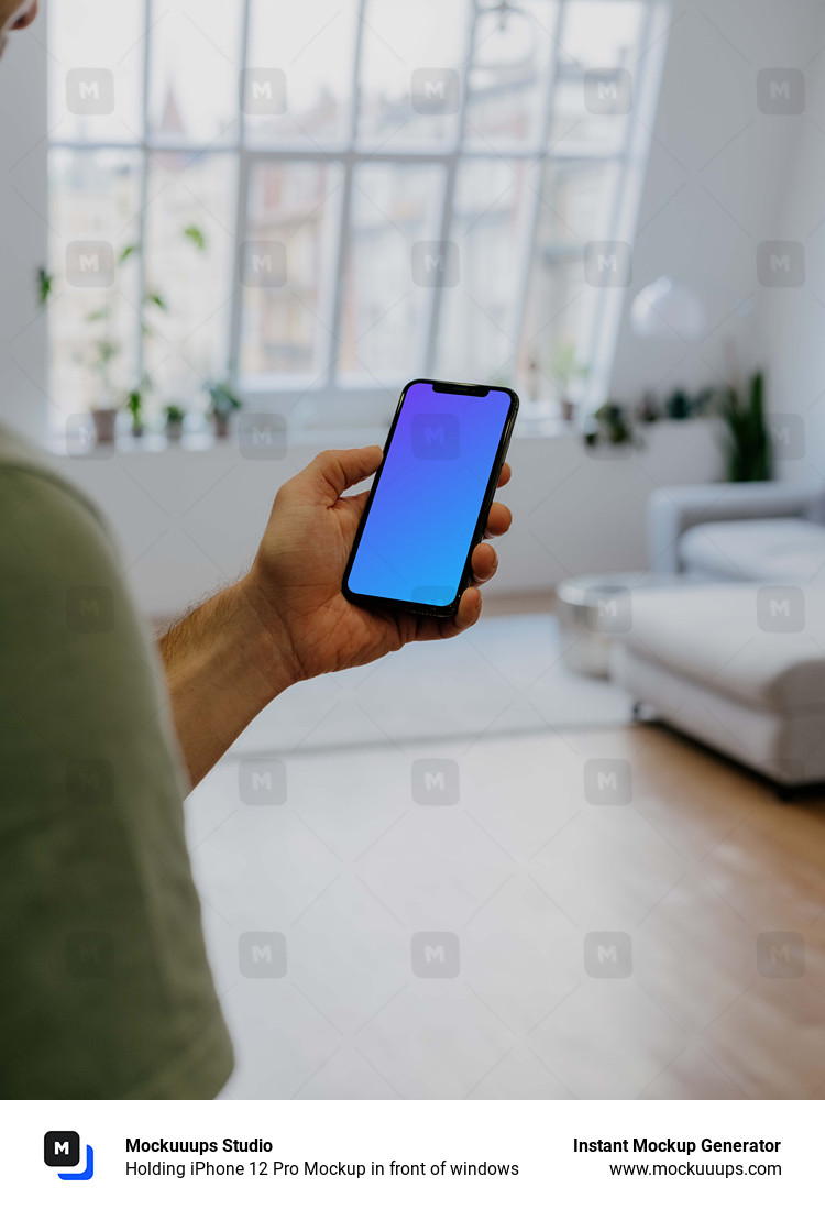 Holding iPhone 12 Pro Mockup in front of windows