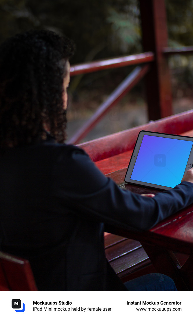 iPad Mini mockup held by female user