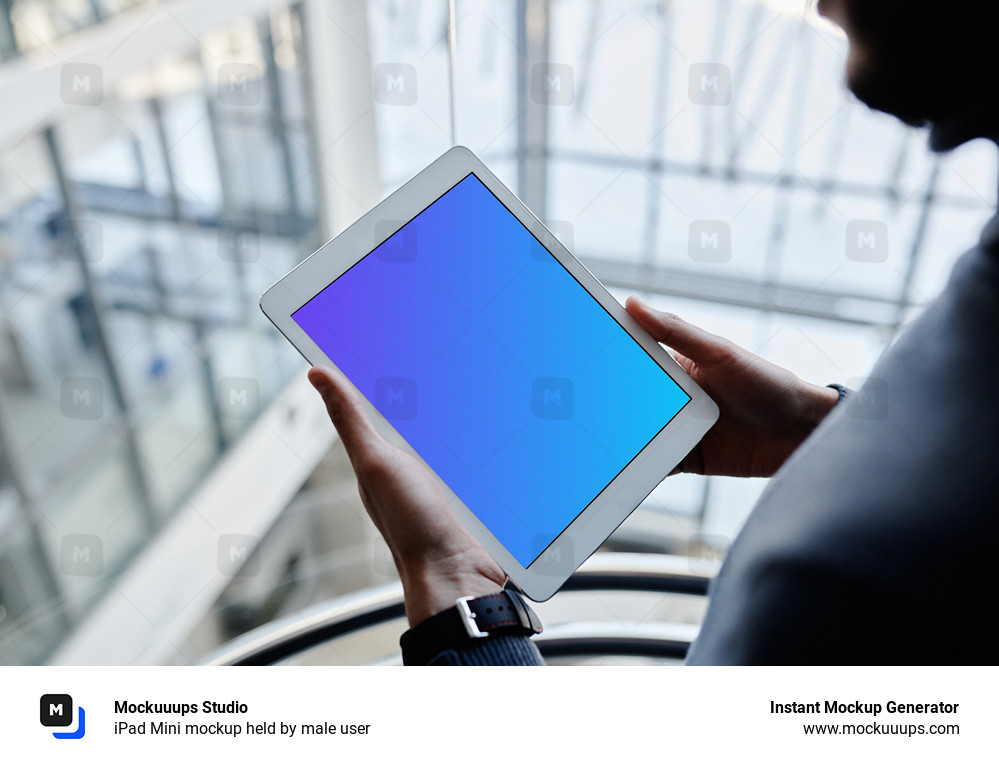 iPad Mini mockup held by male user