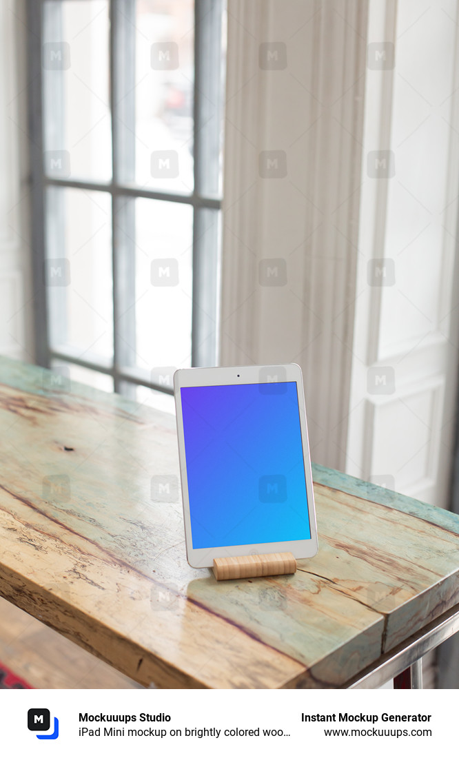 iPad Mini mockup on brightly colored wooden table