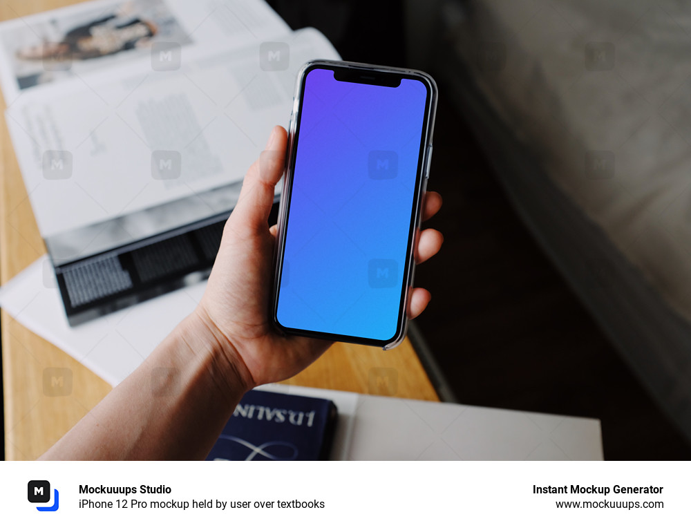 iPhone 12 Pro mockup held by user over textbooks