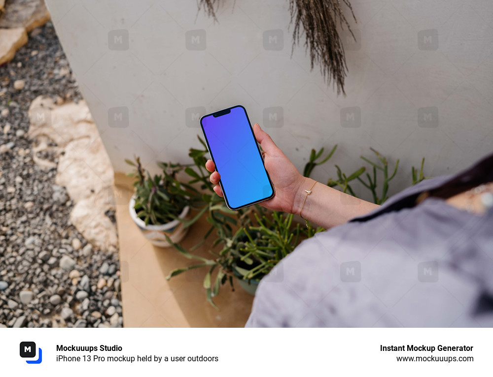 iPhone 13 Pro mockup held by a user outdoors