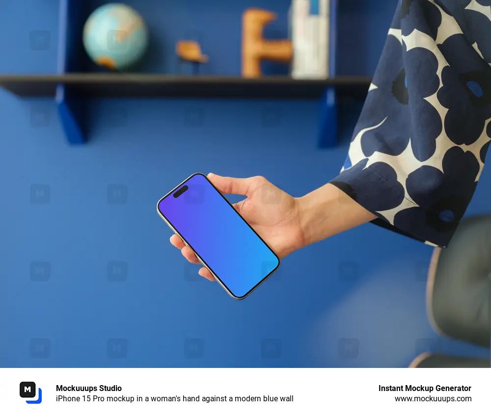 iPhone 15 Pro mockup in a woman's hand against a modern blue wall