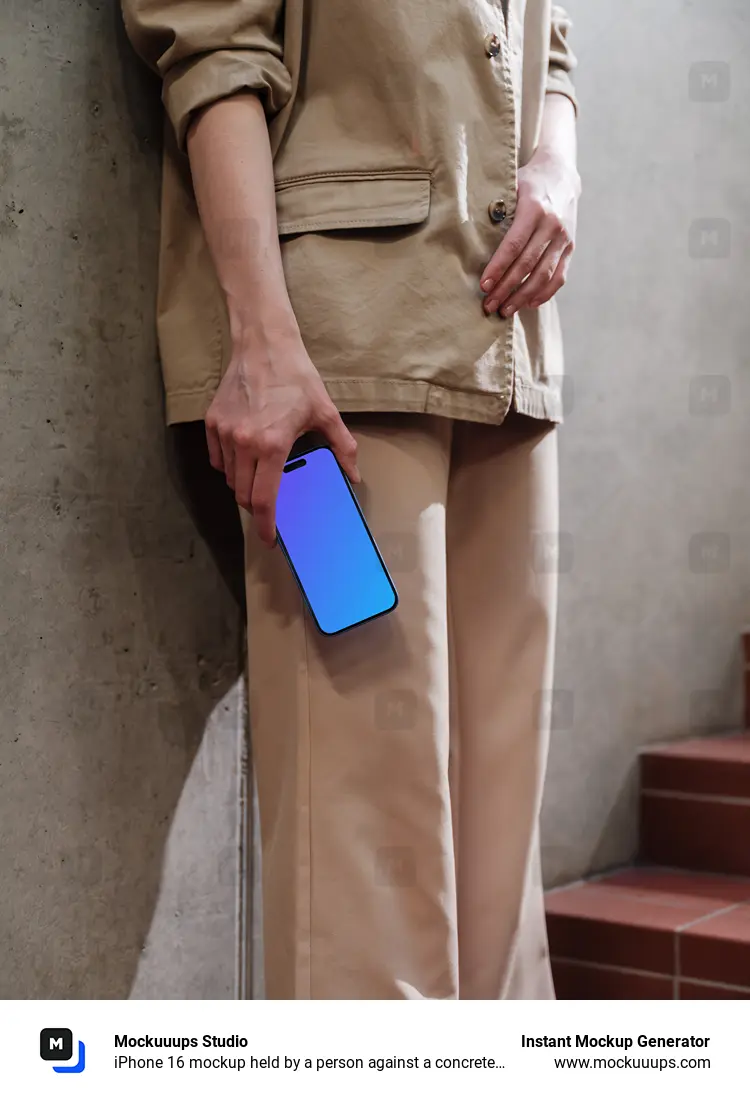 iPhone 16 mockup held by a person against a concrete wall