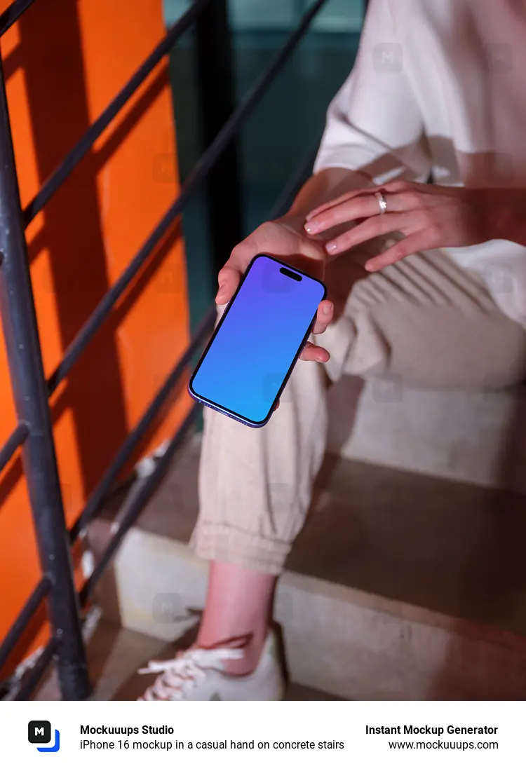 iPhone 16 mockup in a casual hand on concrete stairs