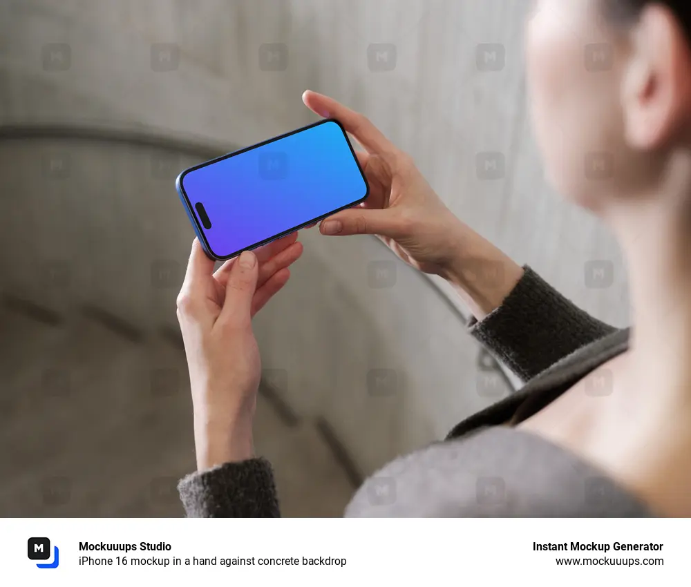 iPhone 16 mockup in a hand against concrete backdrop