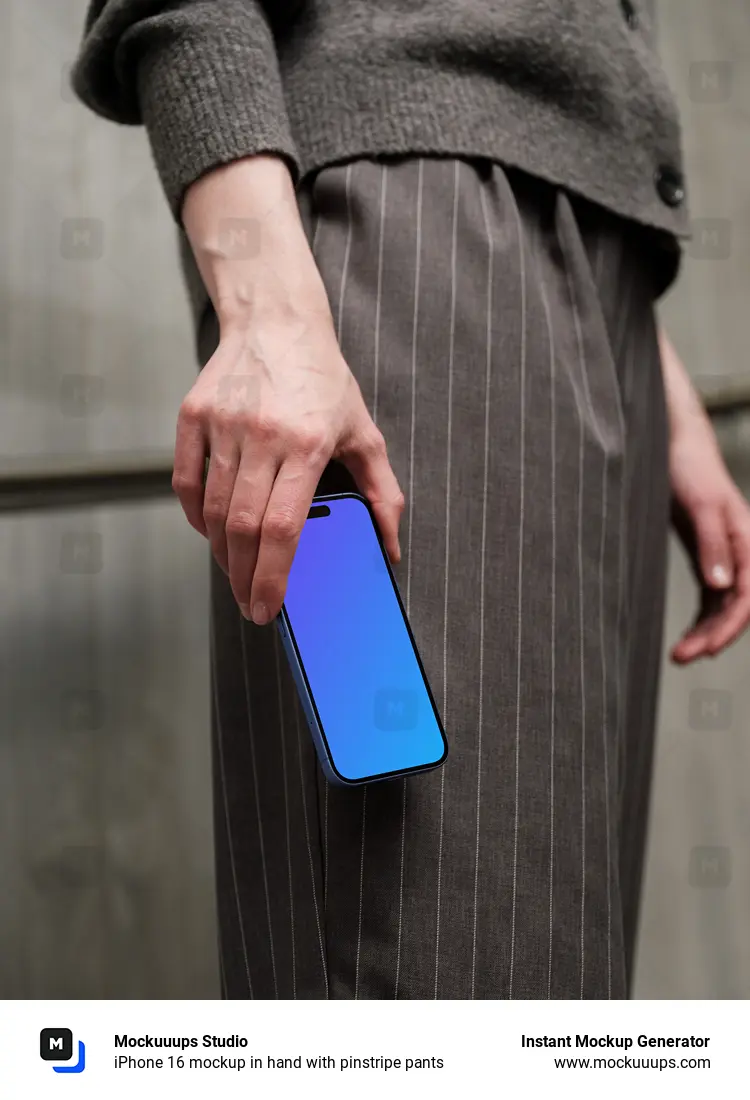 iPhone 16 mockup in hand with pinstripe pants