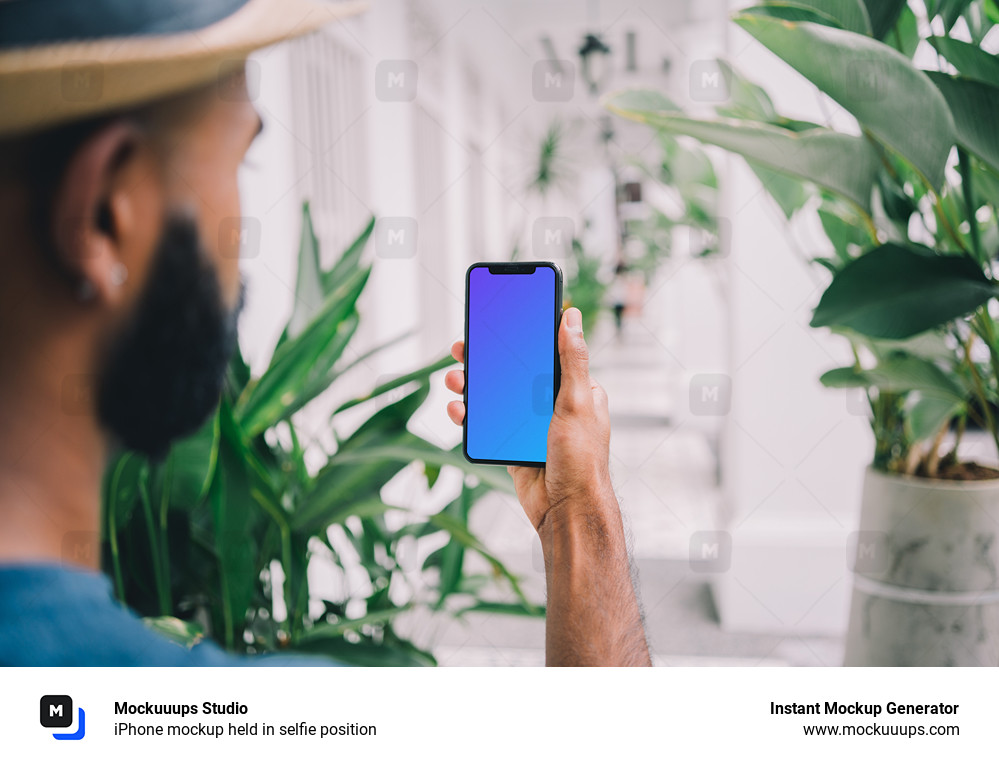 iPhone mockup held in selfie position