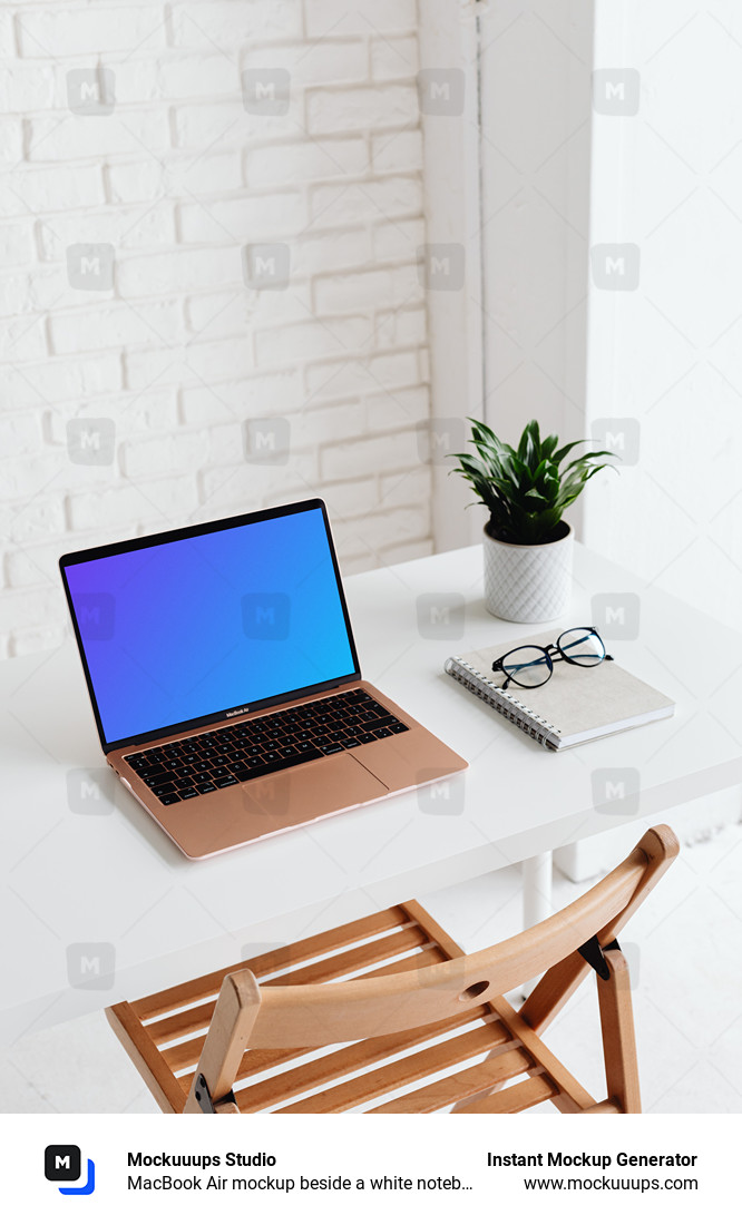 MacBook Air mockup beside a white notebook