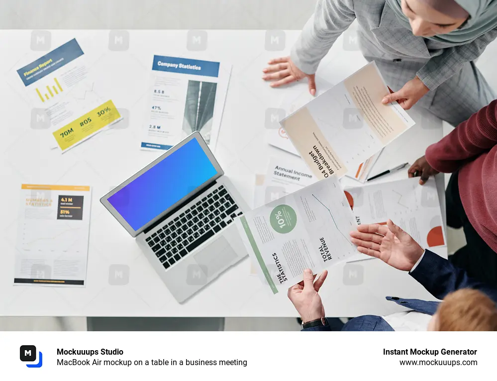 MacBook Air mockup on a table in a business meeting