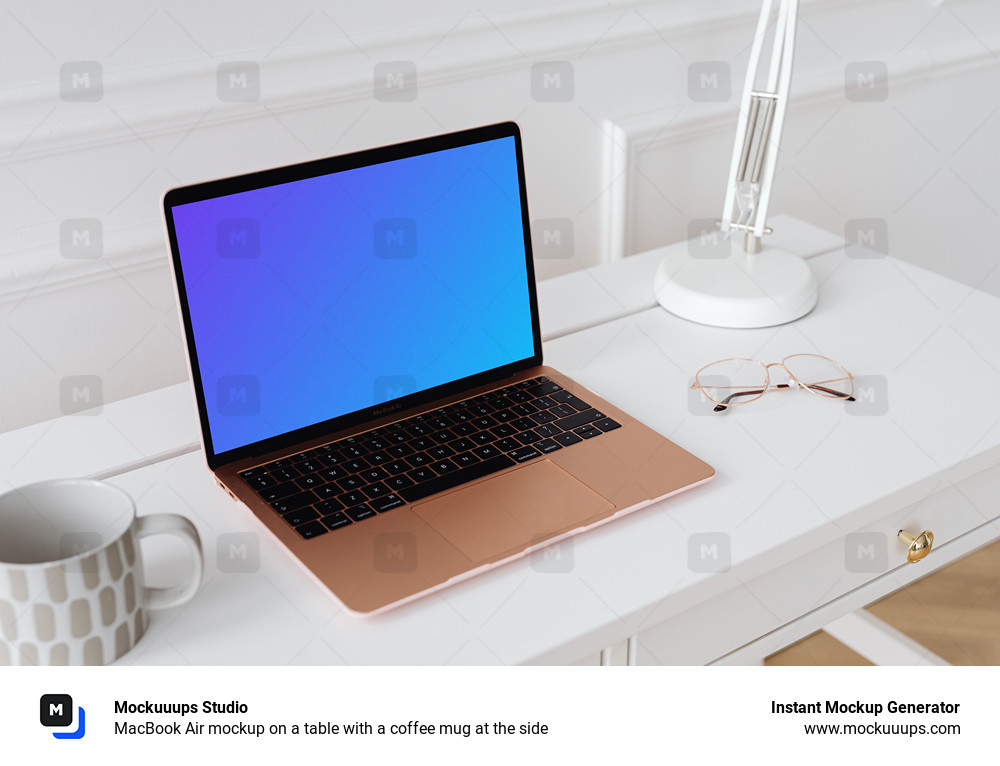 MacBook Air mockup on a table with a coffee mug at the side