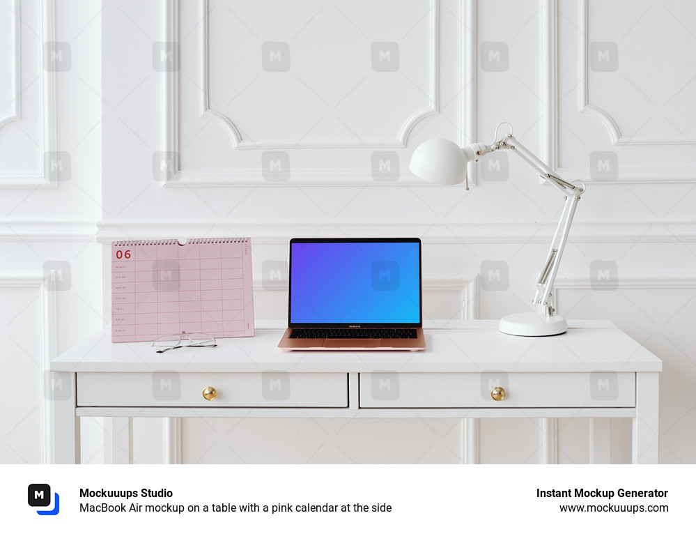MacBook Air mockup on a table with a pink calendar at the side