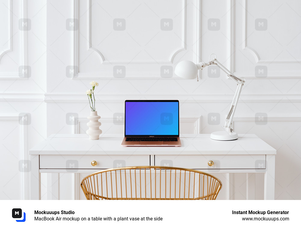 MacBook Air mockup on a table with a plant vase at the side