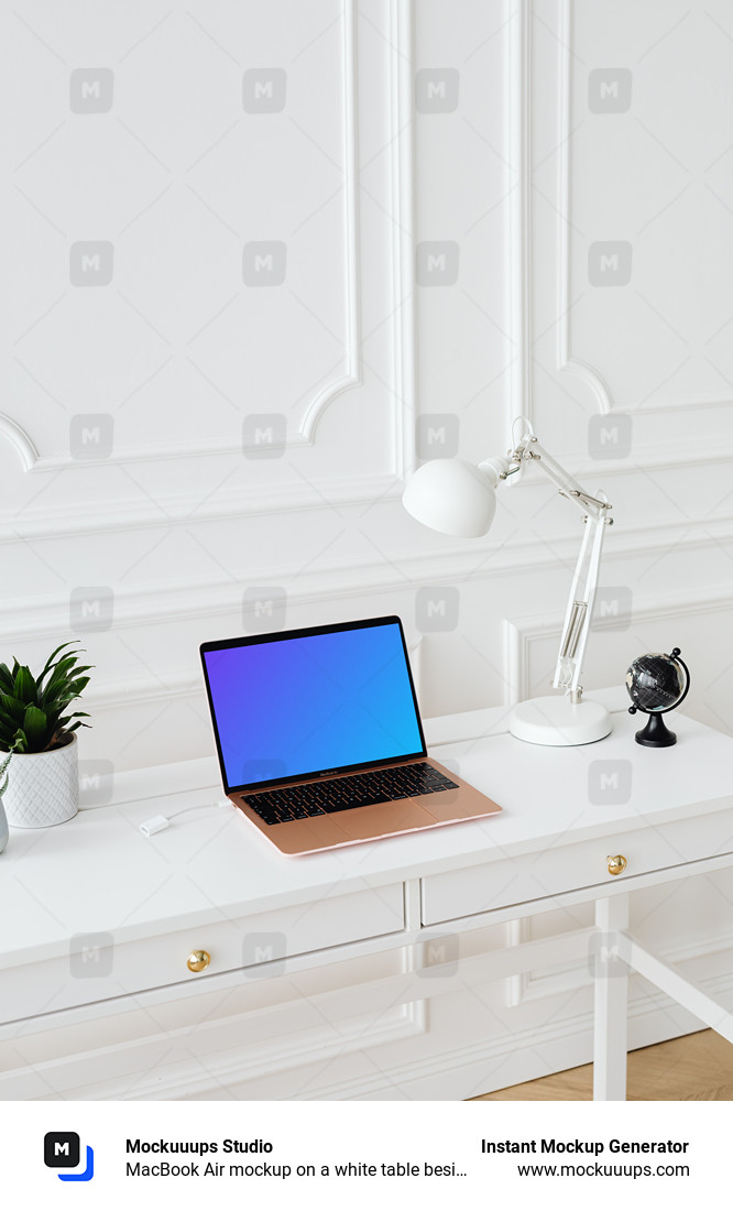 MacBook Air mockup on a white table beside a potted plant