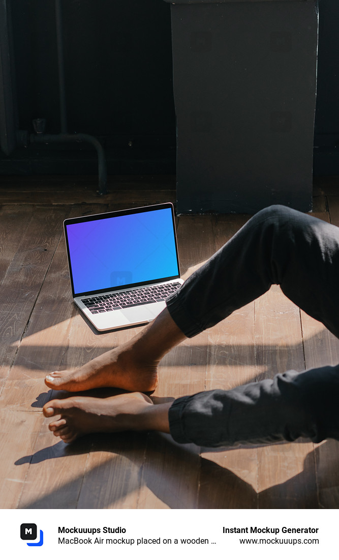 MacBook Air mockup placed on a wooden floor next to a user