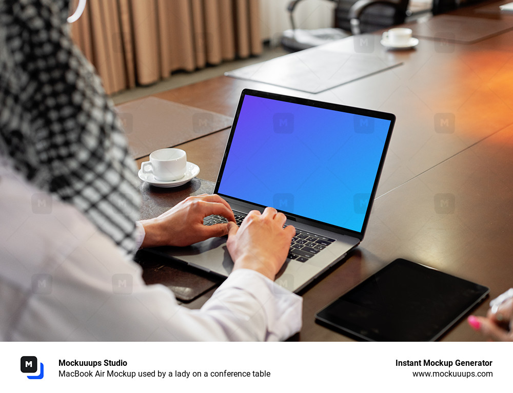 MacBook Air Mockup used by a lady on a conference table