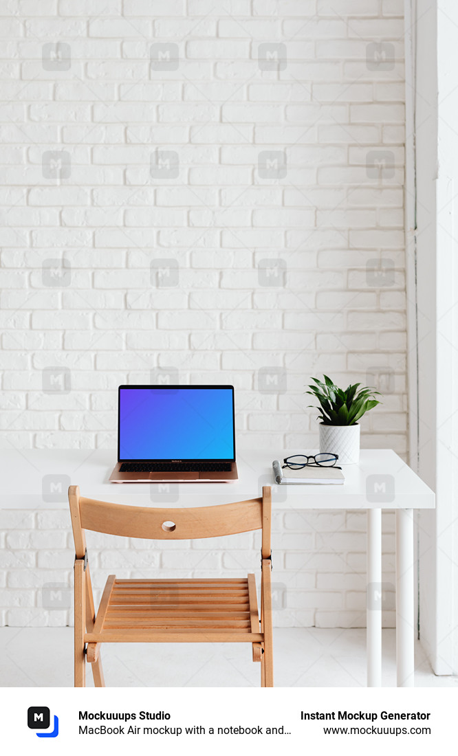 MacBook Air mockup with a notebook and pair of glasses at the side