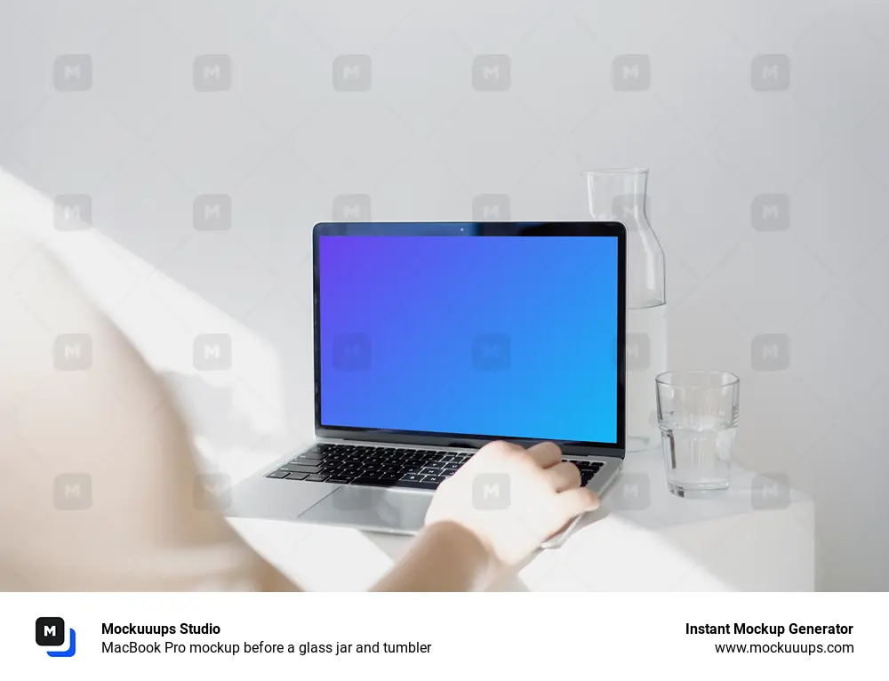 MacBook Pro mockup before a glass jar and tumbler
