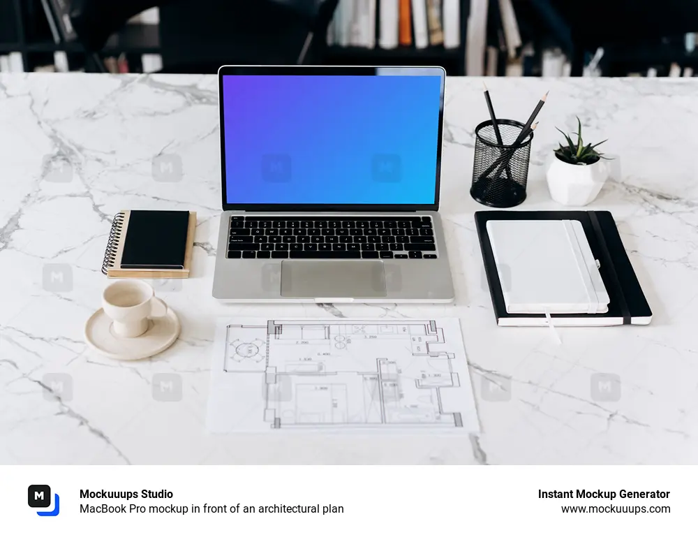 MacBook Pro mockup in front of an architectural plan
