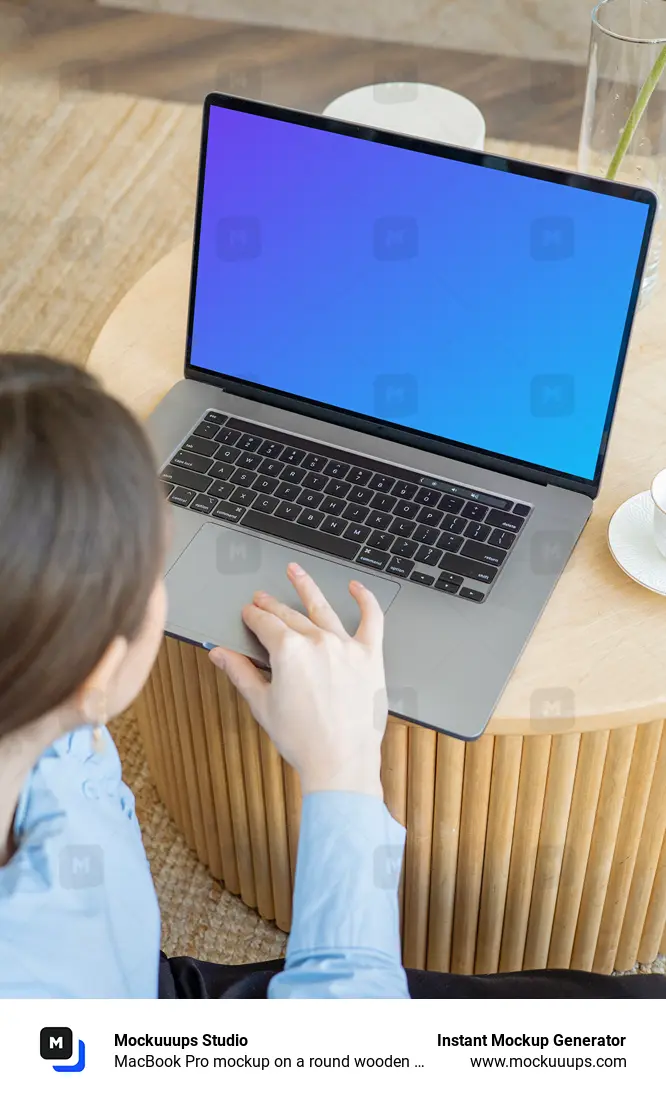 MacBook Pro mockup on a round wooden table