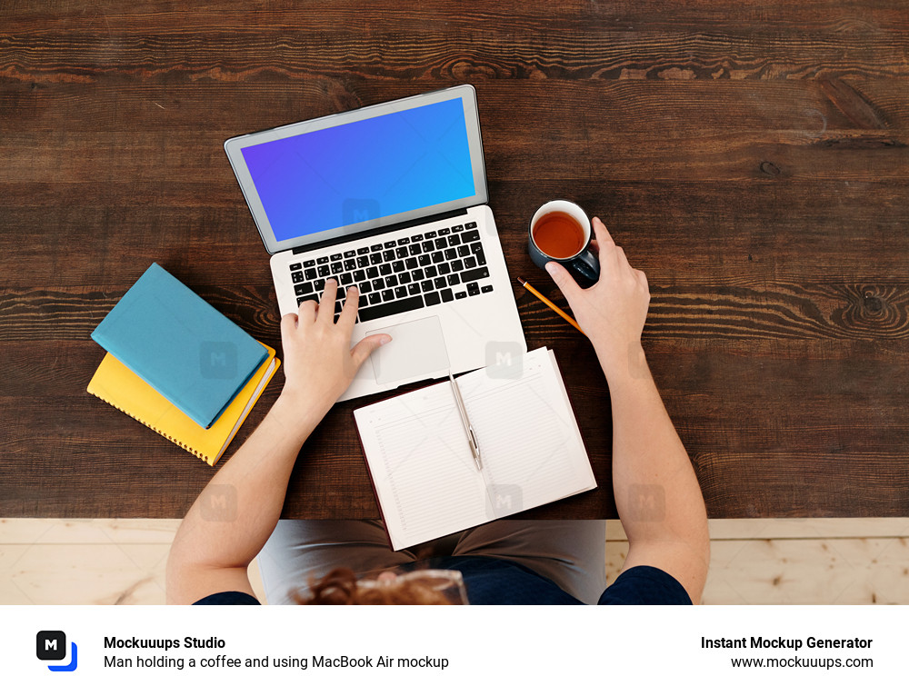 Man holding a coffee and using MacBook Air mockup