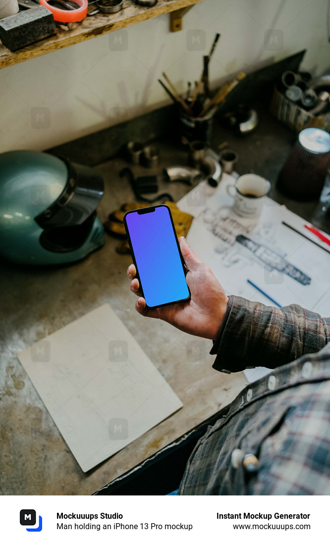 Man holding an iPhone 13 Pro mockup