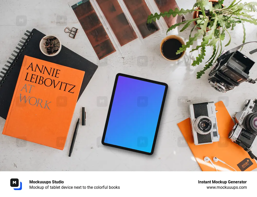 Mockup of tablet device next to the colorful books