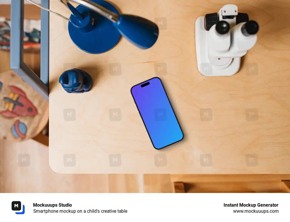 Smartphone mockup on a child's creative table