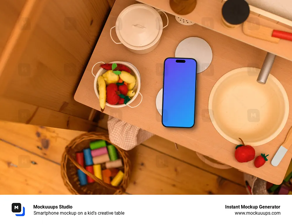 Smartphone mockup on a kid's creative table