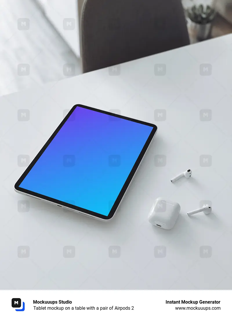 Tablet mockup on a table with a pair of Airpods 2 