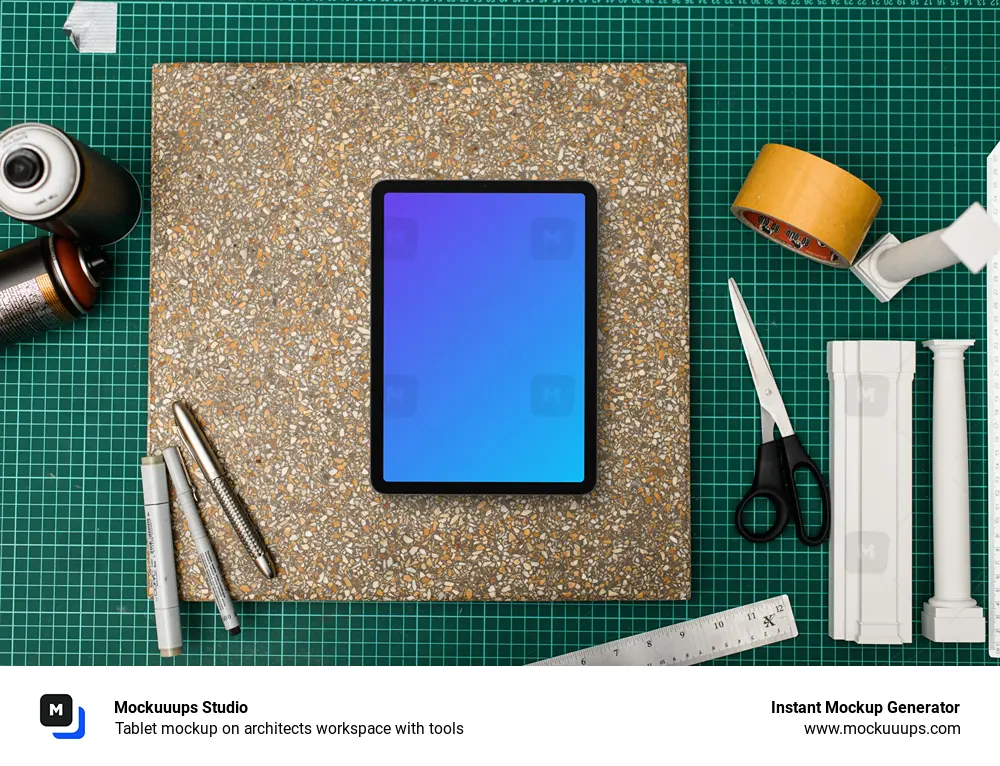 Tablet mockup on architects workspace with tools