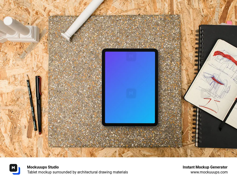 Tablet mockup surrounded by architectural drawing materials