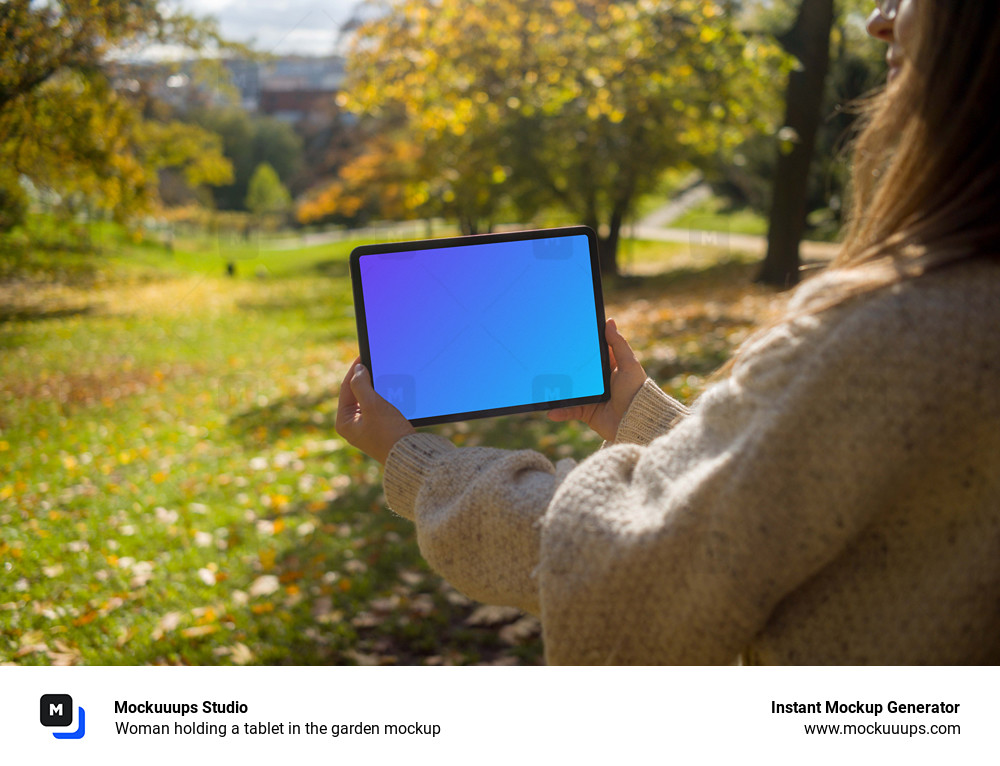 Woman holding a tablet in the garden mockup