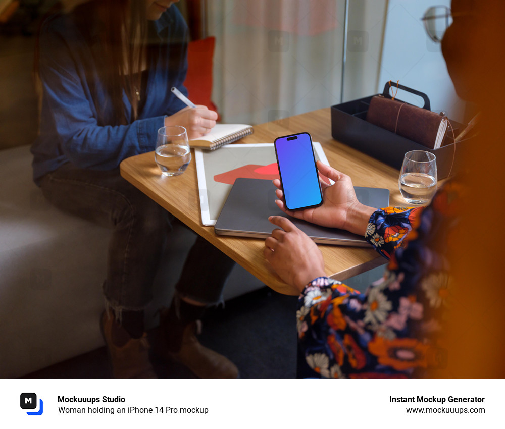 Woman holding an iPhone 14 Pro mockup