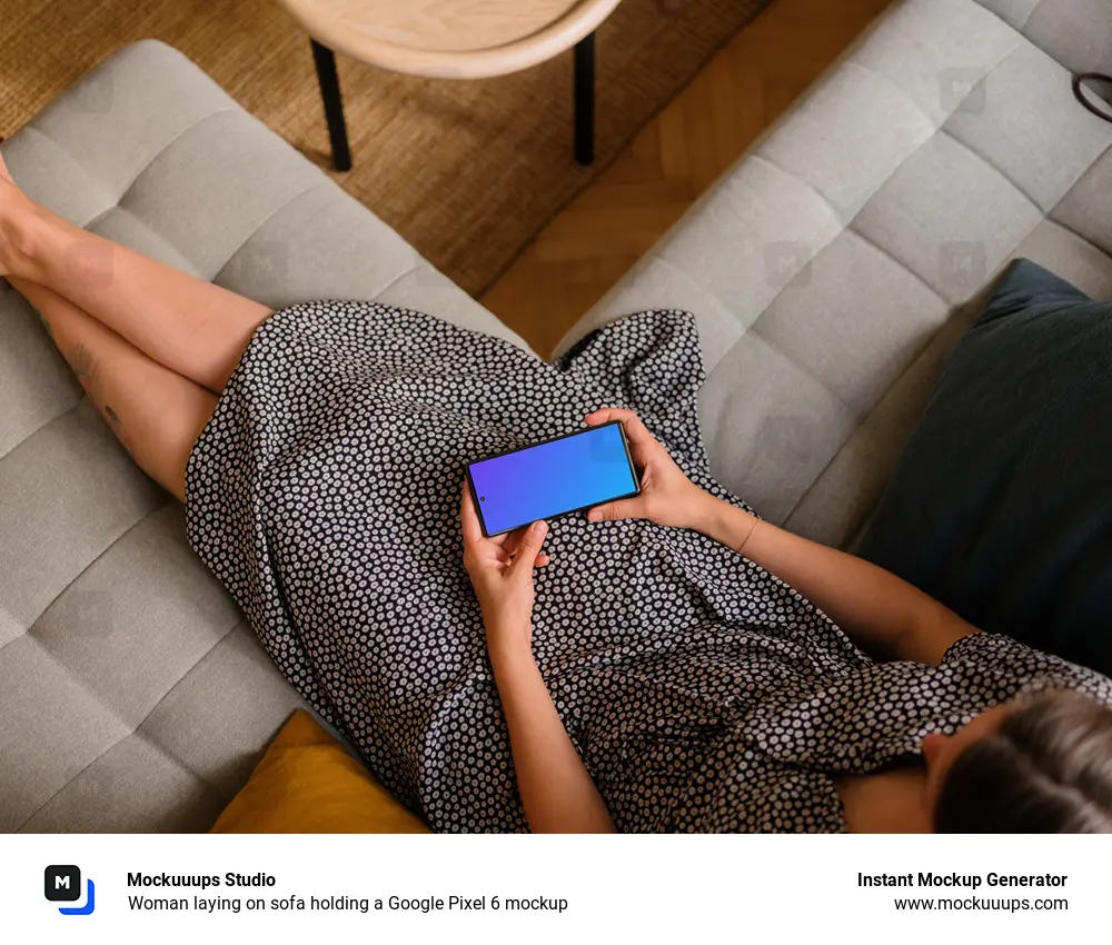 Woman laying on sofa holding a Google Pixel 6 mockup