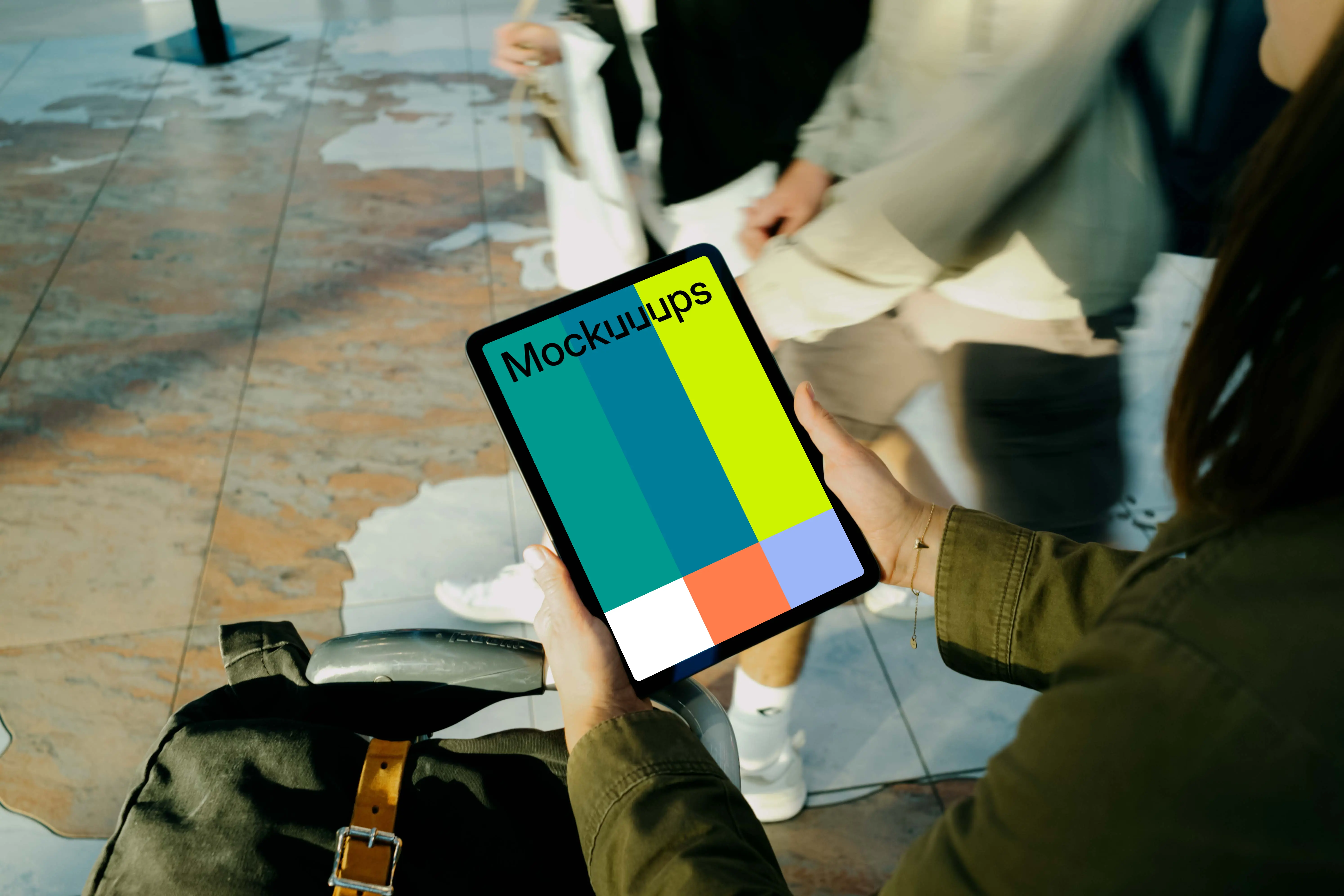 Female hands holding an iPad Air mockup