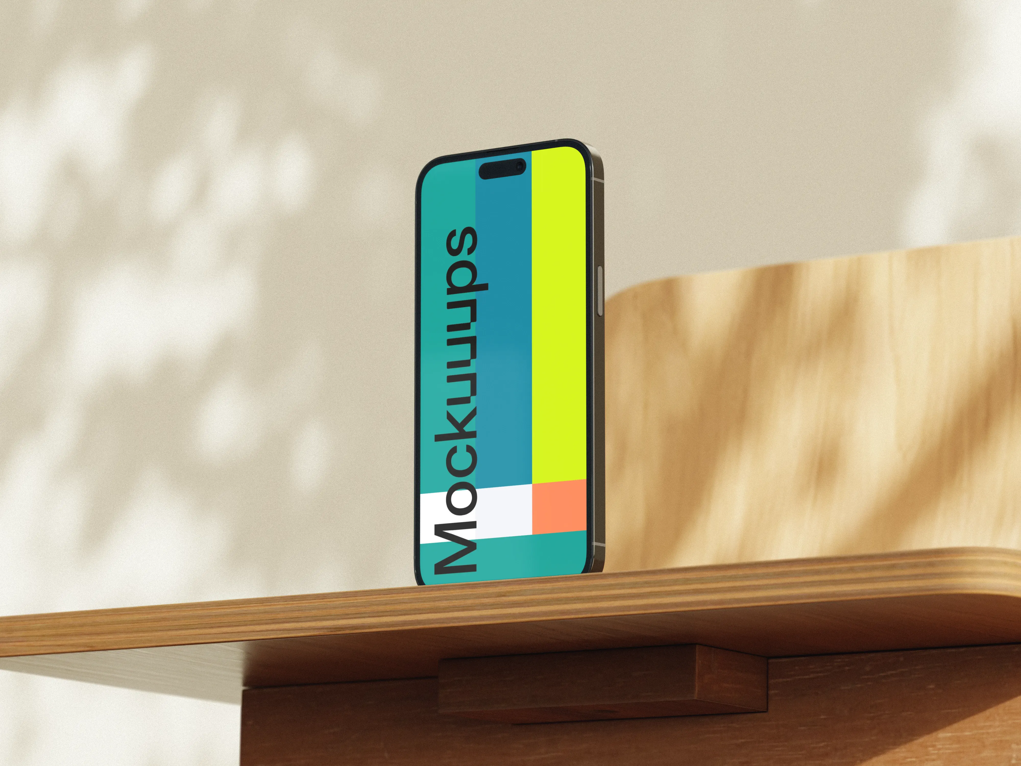 Free iPhone mockup on a wooden desk in sunlight